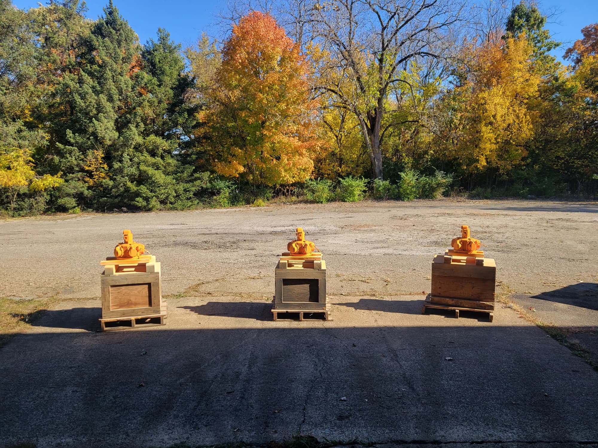 Three crated JOY air motors staged outdoors for shipping