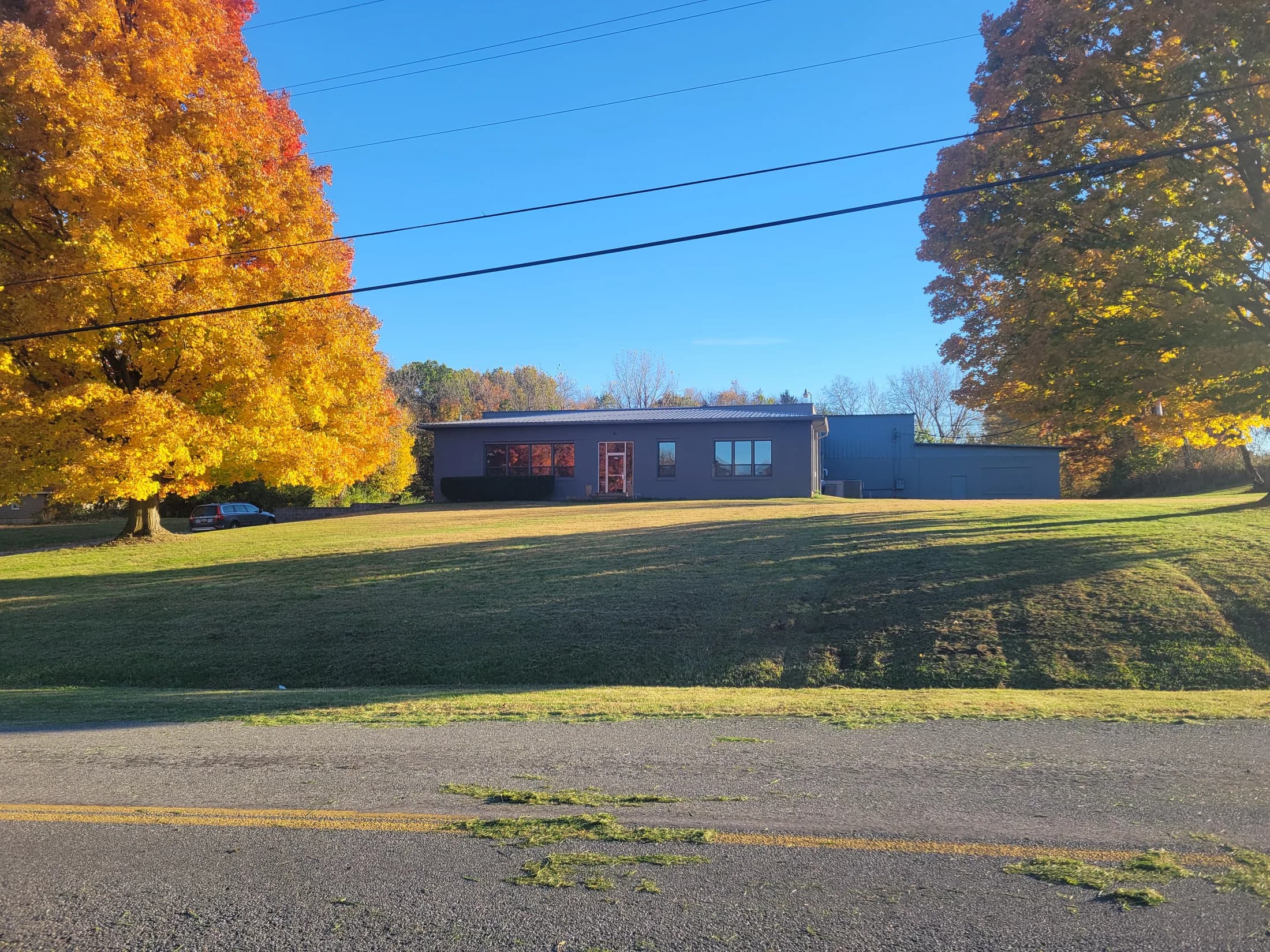GMS Industries facility exterior in Buchanan, Michigan, framed by autumn trees