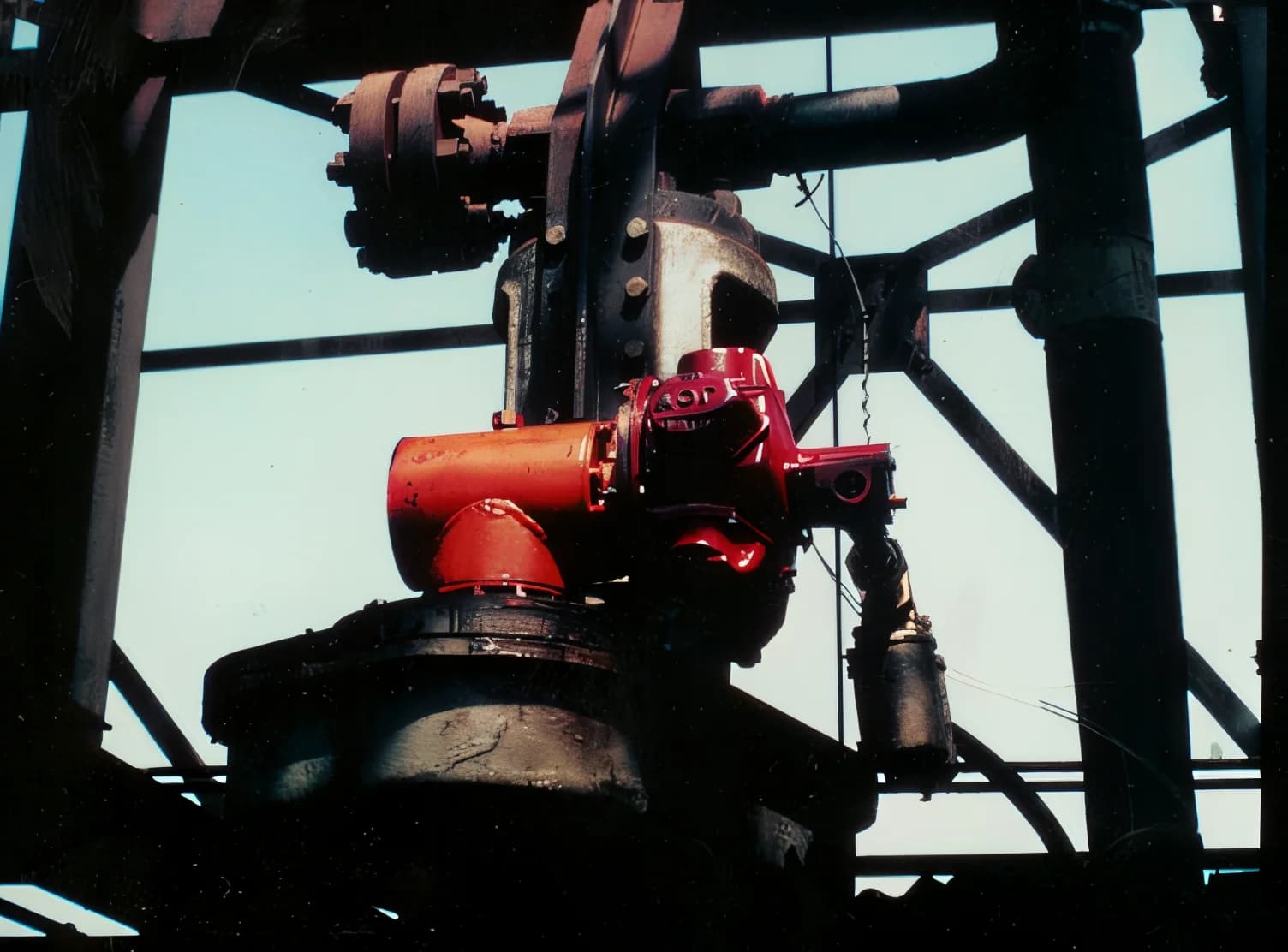 JOY air motor and gearbox installed high in a refinery derrick structure at Koch Refining, archival photograph