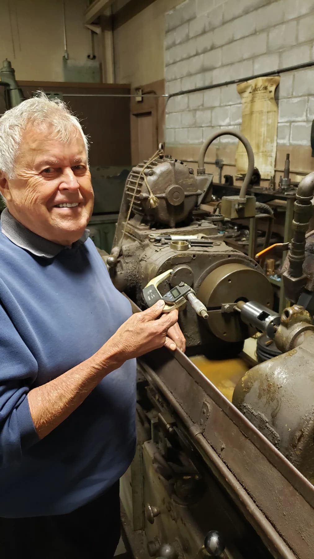 Gerald Smedley at a lathe in the Buchanan machine shop
